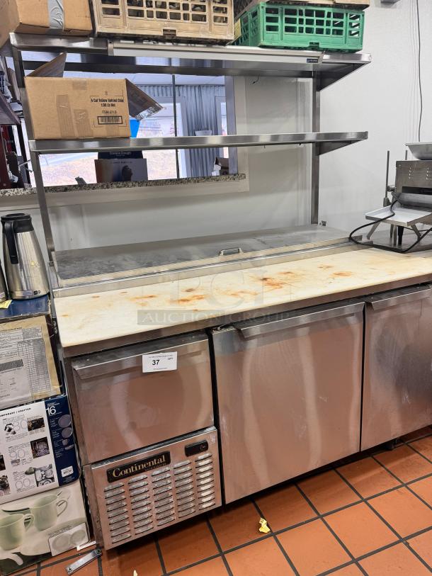 Continental 68" pizza prep-table with overhead shelf. Stainless steel, tested and working. Manufacturer label visible.