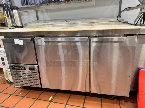 Continental 68" pizza prep-table with overhead shelf, stainless steel, tested and working, visible Continental logo and tag.