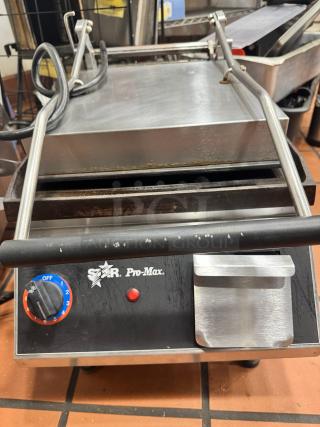 Star Pro-Max Panini Grill, stainless steel, adjustable thermostat, visible wear, branded control panel.