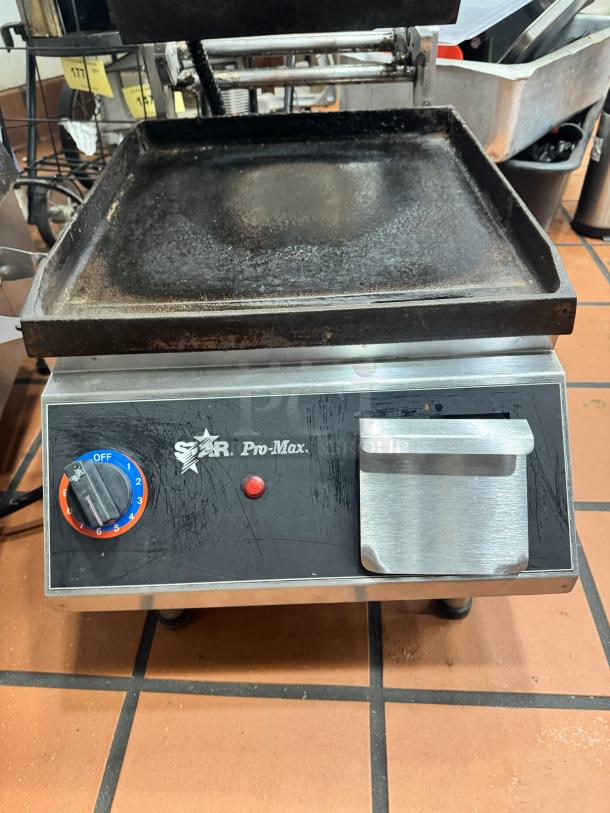 Star Pro-Max Panini Grill, used condition, features adjustable knob, stainless steel exterior, model label on front panel.
