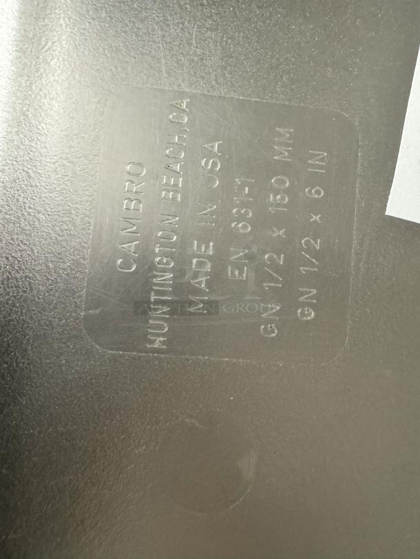 Cambro plastic food pan, model BIDX4. Made in USA, dimensions GN 1/2 x 150 mm. Markings indicate maker and size.