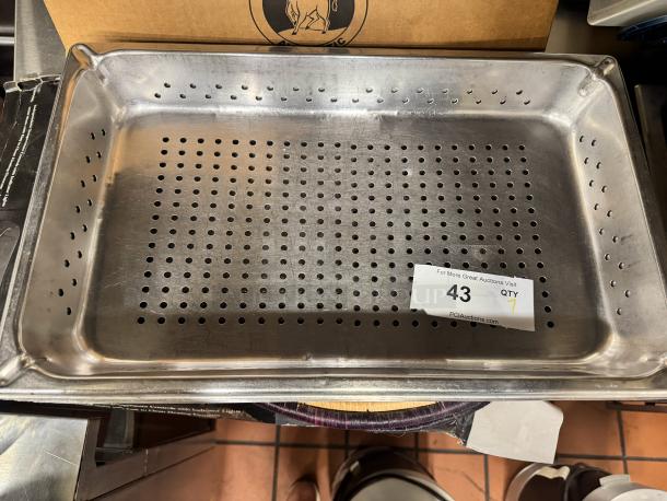 Stainless steel full-size perforated steam pan, marked BIDX7, in good condition; auction label with number 43 attached.