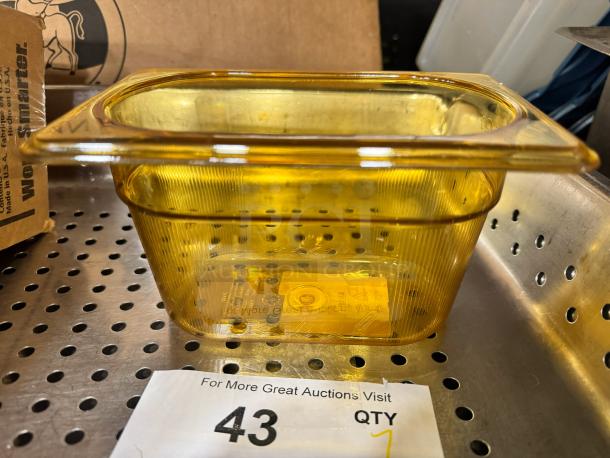 Rubbermaid 1/9 food pan, brand new, amber color, clear ribbed design, durable plastic, auction label marked "43 QTY 7".