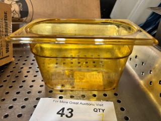 Rubbermaid 1/9 food pan, brand new, amber color, clear ribbed design, durable plastic, auction label marked "43 QTY 7".