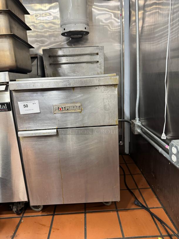 Patriot Natural Gas 40 lb Deep Fryer, stainless steel with visible signs of use, includes control panel and logo badge.