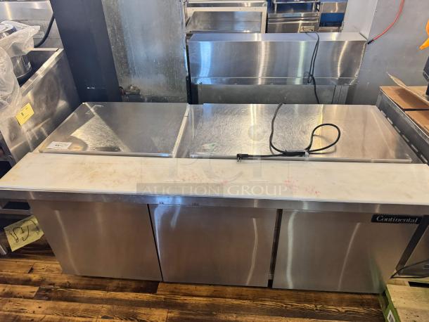 Continental SW72-30M 3-door prep table, features durable stainless steel, one broken handle, tested and working condition.