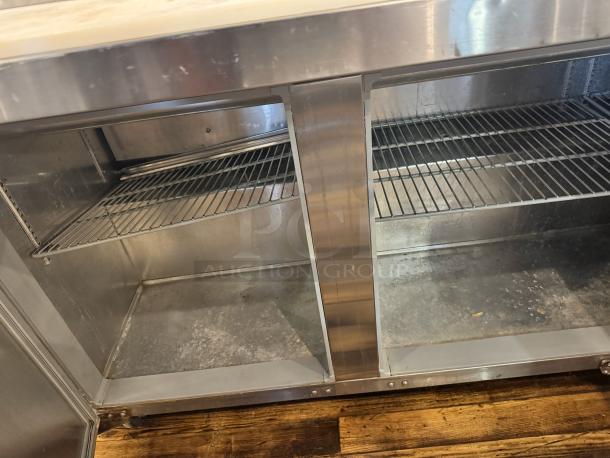 Continental SW72-30M 3-door prep table, stainless steel, one broken handle, tested and working condition.