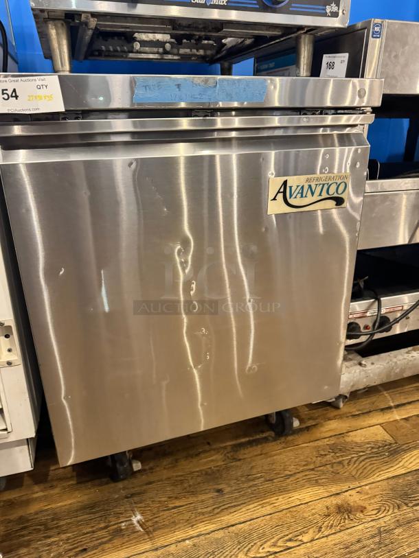 AVATCO undercounter refrigerator model 178TUC27F, stainless steel, tested and working, visible branding and auction tags.