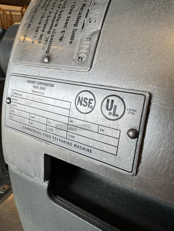 Hobart 2912 commercial meat slicer, NSF and UL listed, model plate visible, serial number 561-151-176, made in USA.