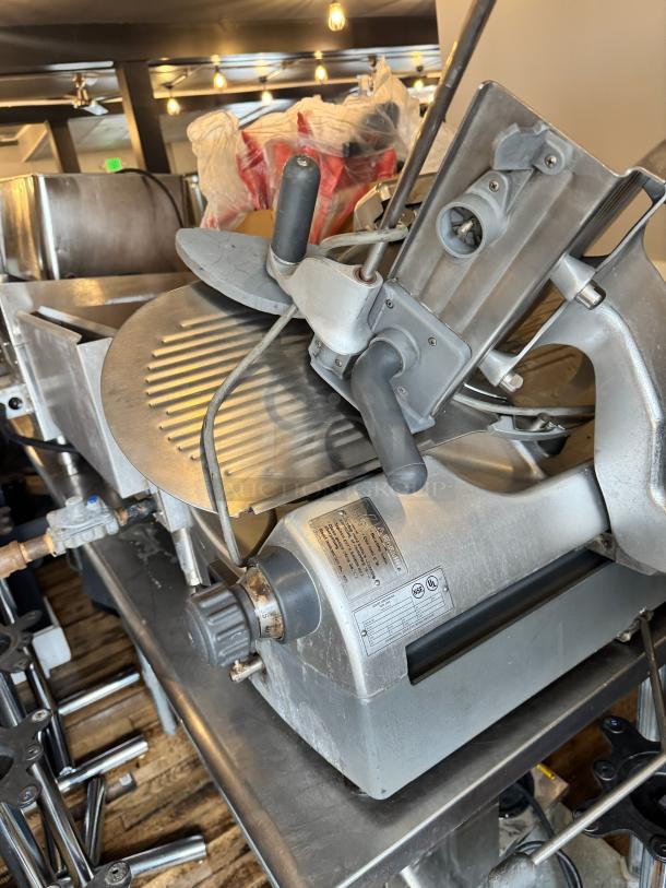 Hobart 2912 commercial meat slicer in good condition, featuring adjustable thickness dial and safety guard, ideal for deli use.