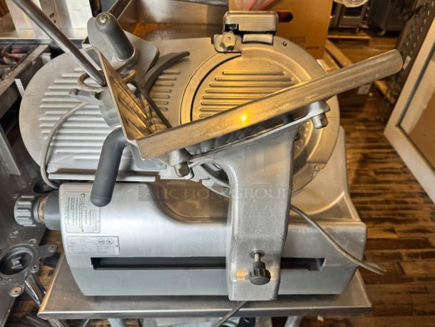 Hobart 2912 Commercial Meat Slicer in good condition, featuring adjustable thickness, sturdy metal build, and visible model label.