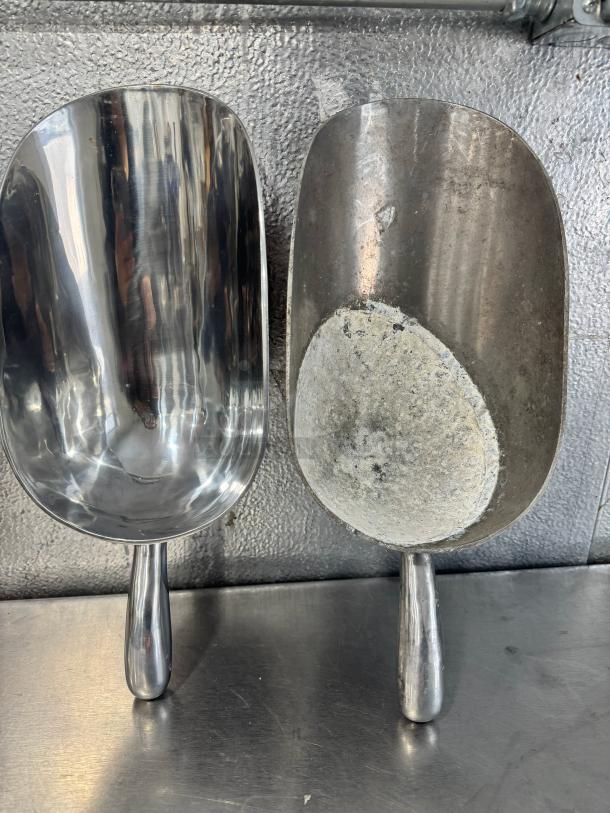 Lot of 2 aluminum scoops, 85oz each, one polished, one with wear. Sold together.