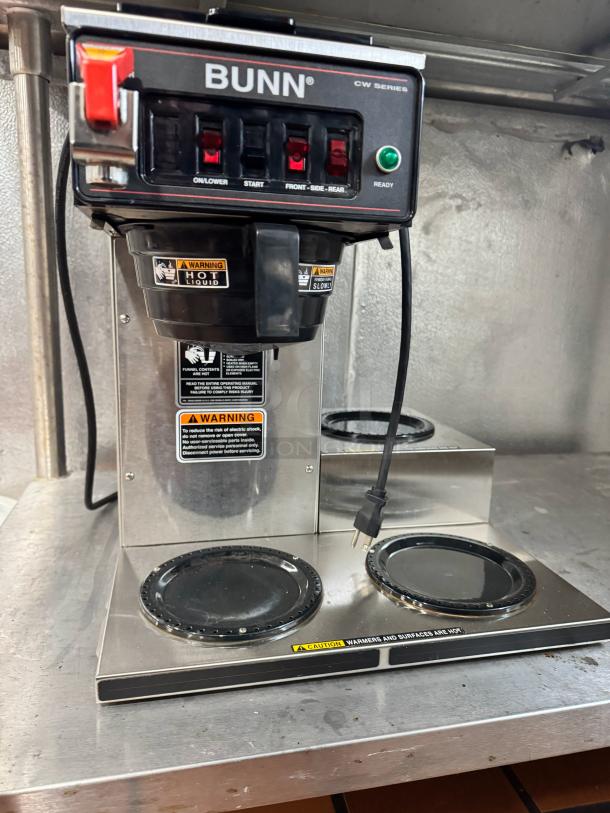 BUNN CWTF15 Coffee Brewer with 3 lower warmers and hot water faucet, featuring operation and warning labels.