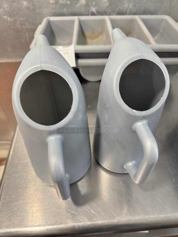 Lot of 2 funnel cake batter pitchers, light gray, plastic, ergonomic handles, good condition.