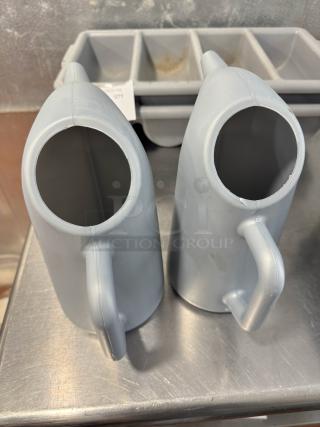 Lot of 2 funnel cake batter pitchers, light gray, plastic, ergonomic handles, good condition.