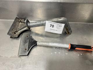 Lot of 2 griddle scrapers, metal and plastic, one by Chef Master. Used condition with visible wear. Auction tag "70 QTY".