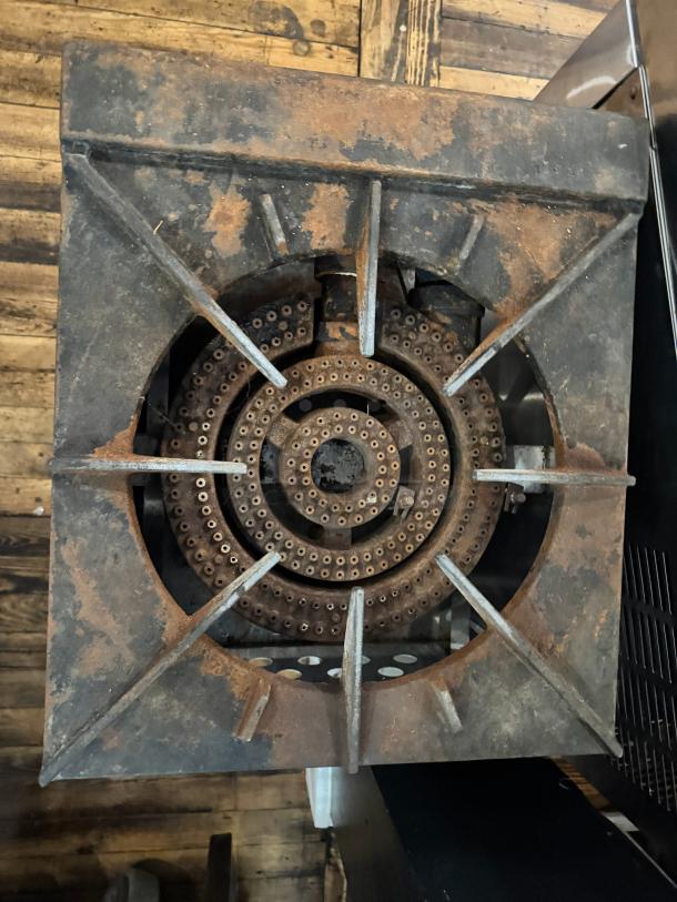 CPG Commercial gas stock pot range, model 361CPGSPRI8L, visibly worn with rust on metal parts.
