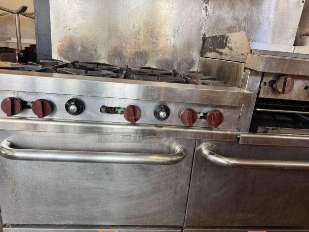 Vulcan 60" commercial gas range with griddle/broiler, two ovens, visible wear, red dials, stainless steel body.