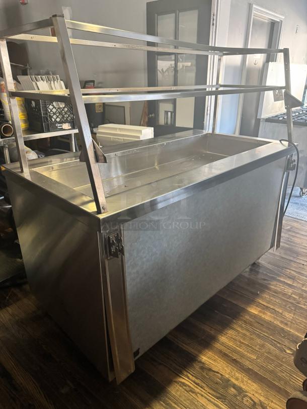 DUKE 60" salad bar TCM-60SS, stainless steel, tested and working, with two-tier display shelves, in good condition.