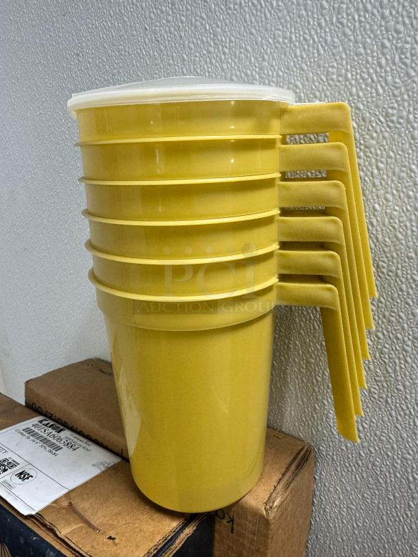 32oz yellow plastic pitchers BIDX40, stackable with handles, in new condition.