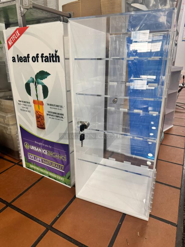 Acrylic Display Cabinet BIDX3 with shelves and lock, clear finish, excellent condition, ideal for showcasing items.
