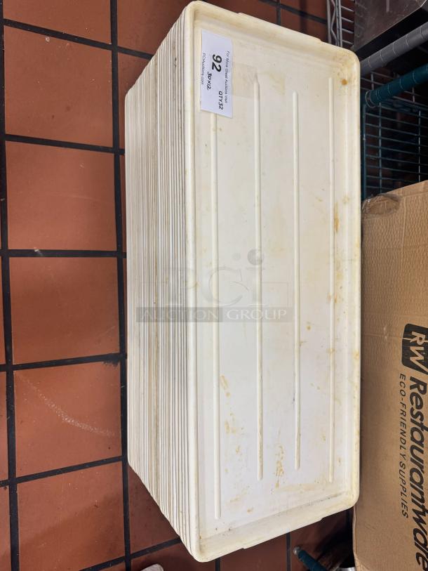 Long white plastic display tray, model BIDX32, with slight discoloration. Auction tag reads "92" and "DTX32".