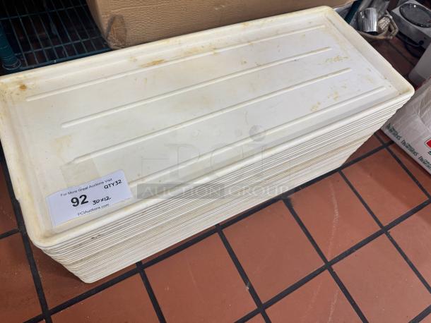Long plastic display tray BIDX32, white, stack of trays, visible wear and dirt, auction label "92 QTY32".