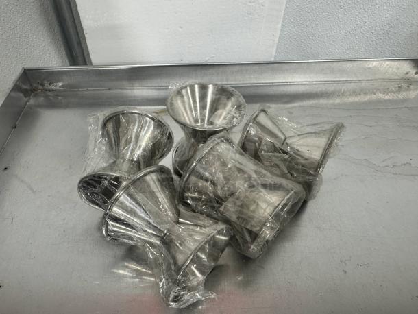 Lot of 5 stainless steel double jiggers, sealed in plastic. Ideal for precise cocktail measuring. Mint condition.