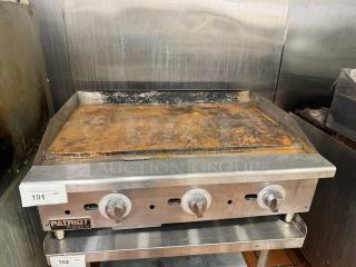 PATRIOT PLATINUM 36" natural gas griddle, worn surface, stainless steel, three control knobs, stand not included.