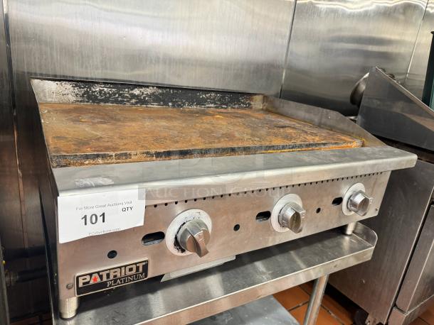 PATRIOT PLATINUM 36" natural gas griddle, worn surface, three control knobs, label reads "101 QTY," stand not included.