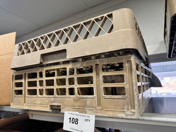 Lot of 3 beige plastic glass racks, stackable, used condition. Marked: "Stak-All, Sltie, Inc., Made in USA." Auction label: "108."