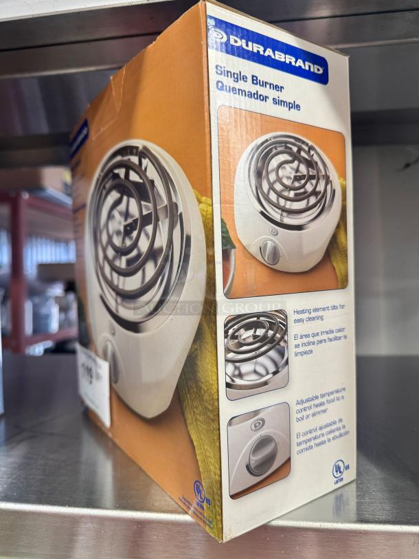 Brand new DURABRAND Single Burner in box, features adjustable temperature control and heating element for easy cleaning.