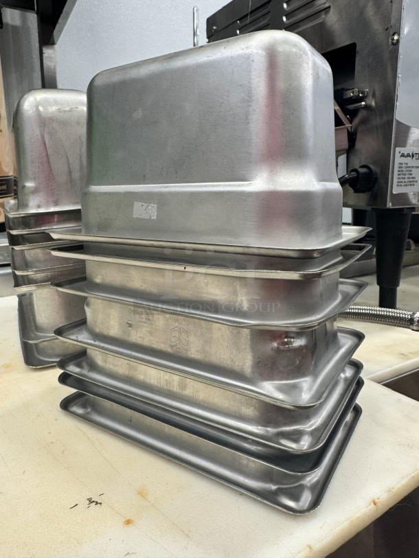 Stainless steel food pan BIDX7 stack, durable, shiny finish, minimal wear, ideal for commercial kitchen use.
