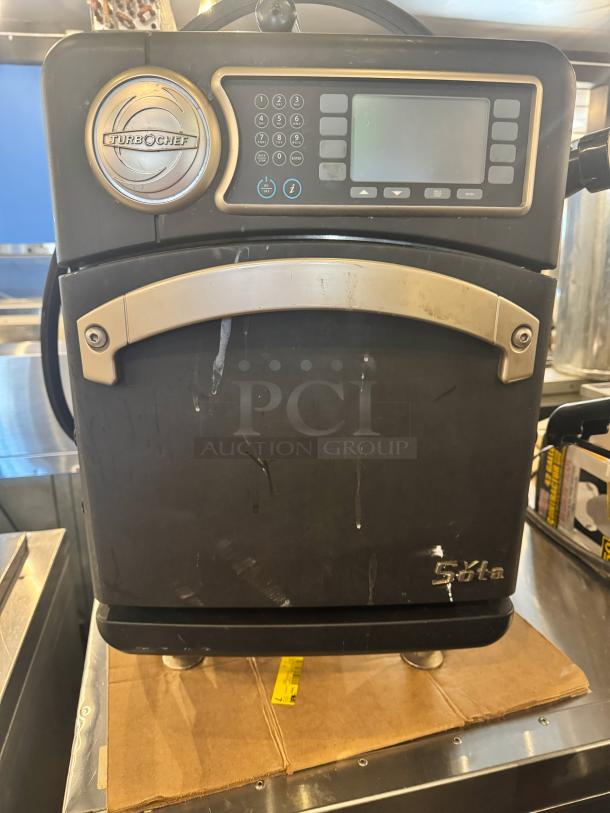TurboChef Sota NGO high-speed countertop oven, black with stainless accents, keypad controls, used condition. Model: NGO.