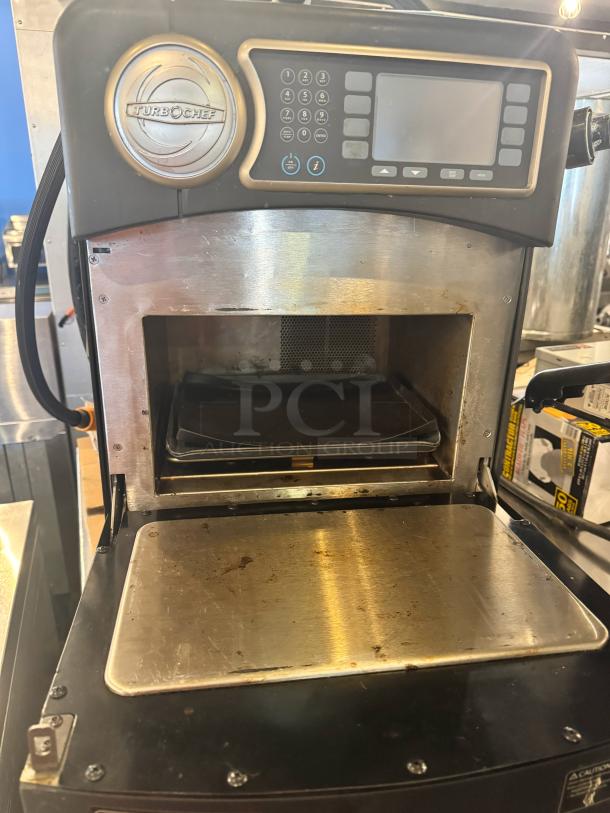 TurboChef Sota NGO high-speed cooking oven, 208/240V. Features digital controls, stainless steel interior. Used condition.