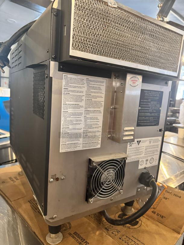 TurboChef Sota NGO high-speed countertop oven, 208/240V, visible ventilation fan, labels with specifications and model details.