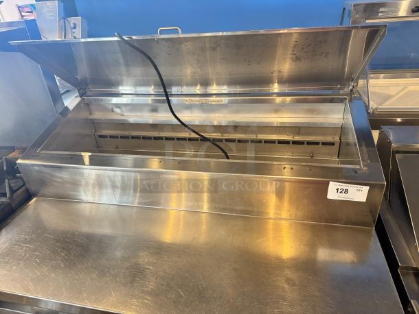 Traulsen 48" Pizza Prep-Table, Model TS048HT, stainless steel, hinged lid open, showing prep area. Auction tag visible.