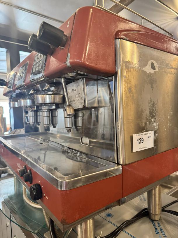 BRASILIA 205EX FNC DIG 3 espresso machine, red, visible wear, three group heads, control panel, auction tag reading "129".