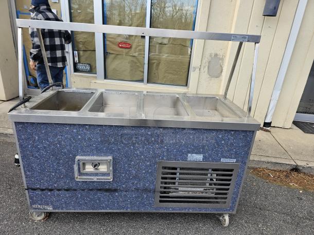 Duke HB4-1H/3C drop-in hot/cold food well unit, 115V, stainless steel, blue exterior, with four compartments, on wheels.