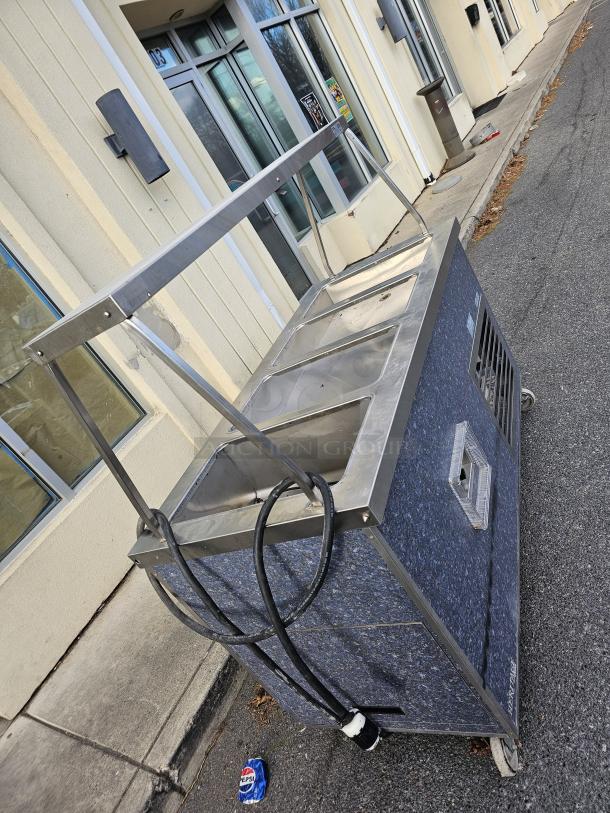 Duke HB4-1H/3C drop-in hot/cold food well unit, 115V, stainless steel, good condition, mobile with wheels and electrical cord.