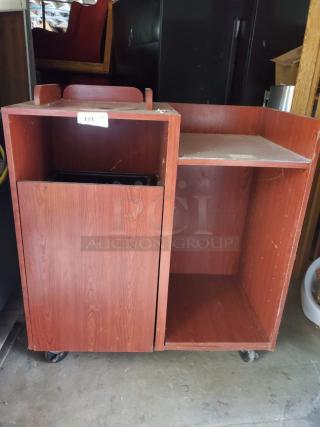 Wood top tray receptacle on wheels, dual compartments, red-brown finish, visible scuff marks, labeled "111."