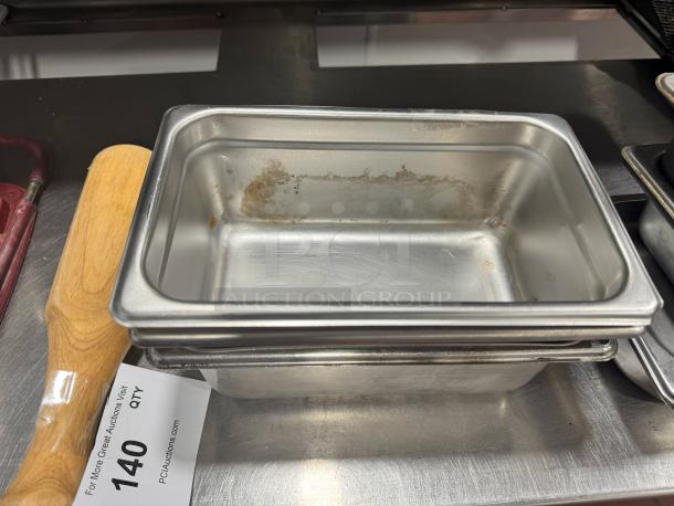 Lot of 3 stainless steel food pans, slightly used, stackable design. Auction label indicates quantity as one lot.