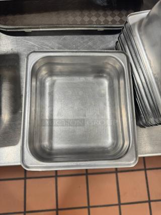 Stainless steel food pan BIDX10, square shape, stackable, used condition with minor surface scratches.