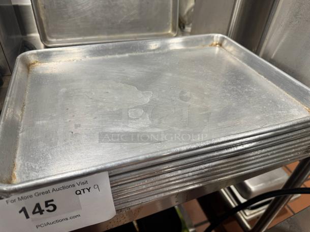 Half size baking pan, model BIDX9, showing moderate wear, with visible stacking marks, labeled as part of lot 145, quantity 9.
