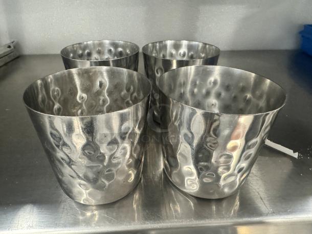 Lot of 4 stainless steel French fry holders with a hammered texture. Used condition, suitable for restaurants or home use.