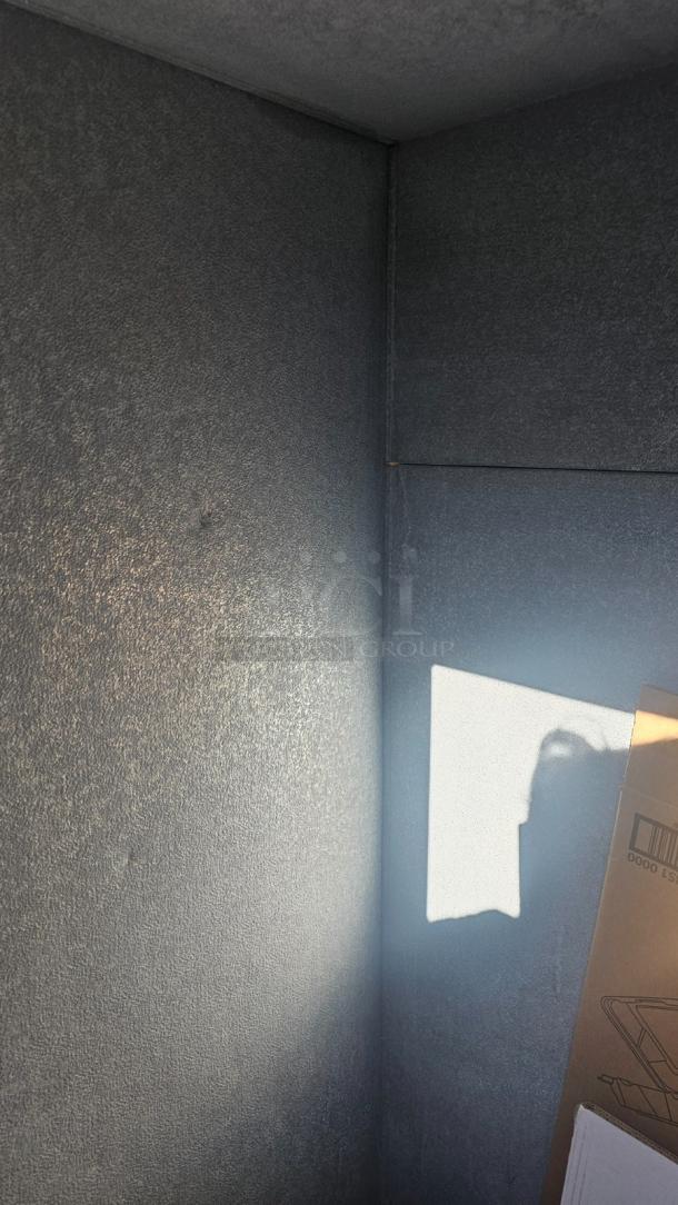 Interior of a commercial outdoor ice merchandiser in good condition, showing insulated walls. Tested & working.