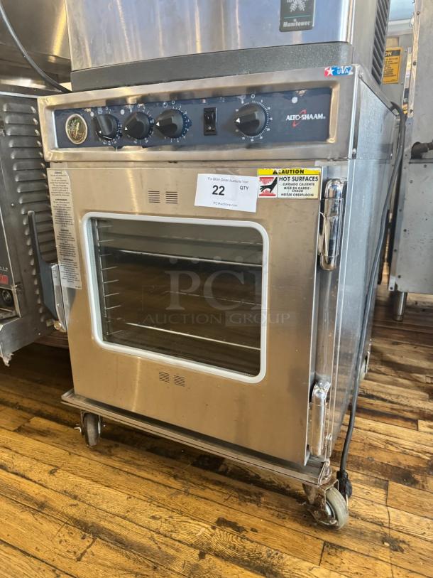 ALTOSHAAM 767-SK Cook & Holder Smoker Oven, stainless steel, 125V, with control knobs, glass door, and caution labels.