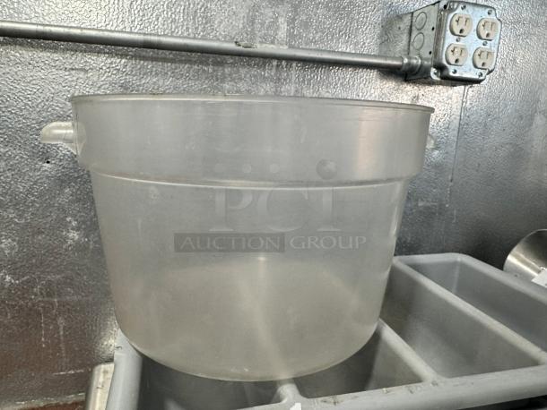 12qt round food storage container, clear plastic, durable handles, good condition, ideal for kitchen use or bulk storage.