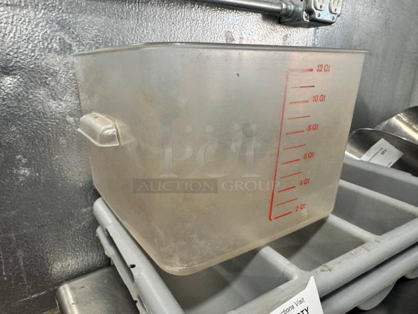 12qt clear plastic food storage container with red measurement markings. Features side handles. Good condition.