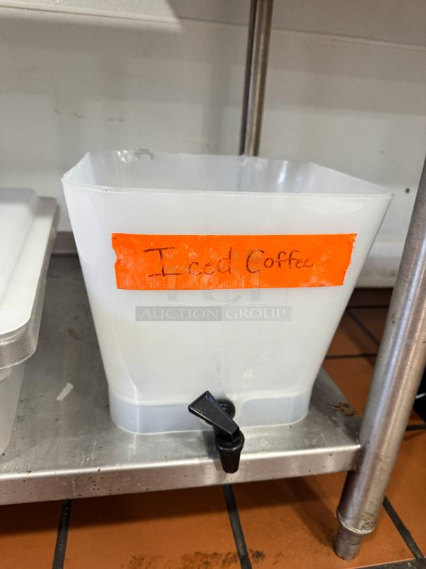 Plastic beverage dispenser missing lid, labeled "Iced Coffee," with spigot, fair condition.